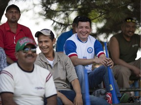 Fans cheer on the Leamington Greenhouse baseball team, a team made up of mostly migrant greenhouse workers, as they take on the Harrow Blues senior team in this file photo from 2016.