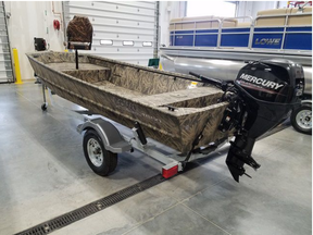A Lowe Roughneck 16 foot fishing boat wrapped in Mossy Oak camouflage (Hull #LWC01892J415) with 25hp Mercury electric tiller motor attached has been stolen. Police  handout