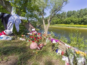 Friends of a sixteen-year-old Brantford boy have placed tributes near the location on Oakhill Drive where the teen drowned in the Grand River on Sunday night. Brian Thompson/Brantford Expositor/Postmedia Network