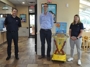 Cornwall Dairy Queen owner Nolan Quinn (centre) received the 2019 Miracle Maker Award from Peter White (left) executive vice-president of Dairy Queen's Canadian Division and Candida Ness, senior marketing director, on Tuesday June 30, 2020 in Cornwall, Ont. Francis Racine/Cornwall Standard-Freeholder/Postmedia Network