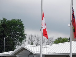 Flags fly at hast-mast outside Augusta's Fire Hall No. 1. Wayne Lowrie/Recorder and Times