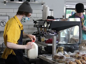 An employee at Mitchell's Café in downtown Fort McMurray wears a mask while making drinks on Thursday, May 14, 2020. Laura Beamish/Fort McMurray Today/Postmedia Network