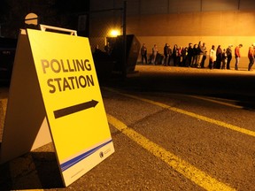 Voters line up at a polling station at Ecole McTavish School, less than 30 minutes before polls closed during the 2017 municipal election on