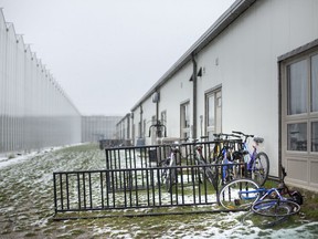 Living quarters for migrant workers is seen next to a greenhouse in the town of Leamington in this file photo from Friday, April 17, 2020.