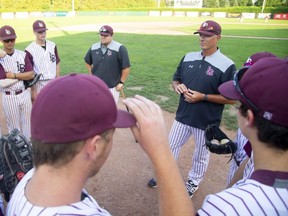 Head coach Mike Lumley, of the London Badgers, huddles with his team before their game against the St. Thomas Tomcats last summer at Labatt Park. Baseball Ontario drafted a return-to-sport protocol that was released last week and approved by the organization’s board of management Thursday.(Mike Hensen/The London Free Press)