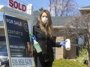 Melissa Laprise, a sales representative for Century 21 shows the realities of selling a home in London, Ont. during the COVID-19 pandemic. (Mike Hensen/The London Free Press)