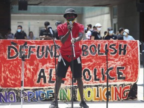Activist Desmond Cole spoke at rally held at Nathan Phillips Square -put together by a group called "No Pride in Policing Coalition" - asking to abolish, defund, disarm police forces in Toronto and across Canada on Sunday June 28, 2020.