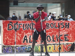 Activist Desmond Cole spoke at rally held at Nathan Phillips Square -put together by a group called "No Pride in Policing Coalition" - asking to abolish, defund, disarm police forces in Toronto and across Canada on Sunday June 28, 2020.