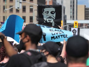 Thousands gathered to join a Black Lives Matter protest march in downtown Ottawa in early June.