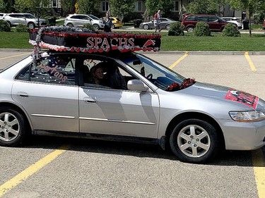Several students decorated their cars in the manner they would have decorated their traditional caps and gowns.