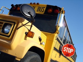 Yellow school bus stopped to pick up a student