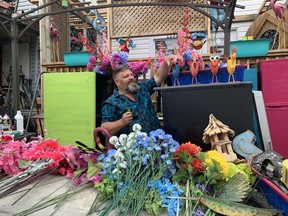 Dan Seguin displays flowers he recently purchased for his home at 1131 Cassells St. Seguin and his wife acquired the property, located next to his home at 1135 Cassells St., earlier this year to help increase tourism to the city. Jennifer Hamilton-McCharles/The Nugget
