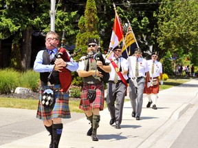 Members of a Port Dover Legion colour guard marked Canada Day Wednesday with a bagpipe procession down Main Street. Wishing their country well on the occasion of the 153rd anniversary of Confederation were, from left, Ian McFadden, Murray McKnight, Ken McKay, Chris Tietz and Jim Pilkington, all of Port Dover. – Monte Sonnenberg photo