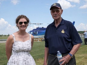 Emily Crombez, on the left, received her first flight lessons at the Tillsonburg Regional Airport from Harvey Roddick, on the right, in 2003. Crombez was recognized by the East Canada Section of the 99s with a commemorative stamp. (Chris Abbott/Postmedia Network)