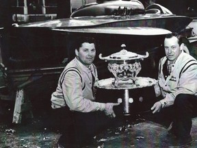 Hydroplane driver Ken Helwig, left, of Sarnia, Ont., and mechanic Don Rowbottom hold the William Braden Memorial Trophy after winning a Canadian championship in 1963. (Contributed Photo)