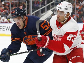 Edmonton Oilers forward Patrick Russell (52) and Detroit Red Wings defensemen Trevor Daley (83) battle for position during fall 2019 action. (Perry Nelson-USA TODAY)