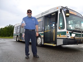 Bus operator Derek Tucker awaits folks seeing relief from the heat in Lively on Sunday afternoon. The city made buses available as cooling stations in various locations over the weekend.