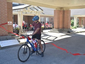 Connor Adams completes his month-long 657-kilometre bike ride marathon in support of local charities on July 1.  Daniel Caudle