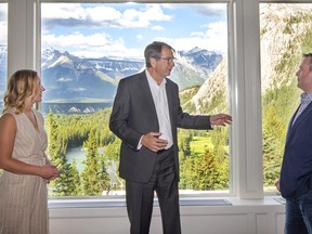 Miranda Rosin, MLA for Banff/Kananaskis, David Roberts, general manager of the Fairmont Banff Springs Hotel and special guest Alberta Premier Jason Kenney, chat in front of the scenic picture windows at the Grand Opening of the newly renovated Rundle Bar at the Banff Springs Hotel on Friday, July 3, 2020. Premier Kenney cut the ribbon to officially open the bar. photo by Pam Doyle/www.pamdoylephoto.com