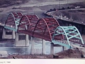 For the first time since construction began, the new traffic bridge is free from supports it had underneath throughout. Steel contractors Canada Iron removed its portable piers giving the bridge the look it would have when carrying traffic. Note: Photograph is taken from Alberta Government video.