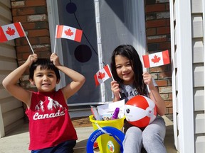 Children use backyard buckets to help celebrate Canada Day in Peace River this year.