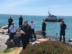 The Paramedic Memorial Bell, which is usually kept in Ottawa, is travelling Ontario to be seen by medics across the province. The bell is inscribed with the names of paramedics that have fallen while on the job. Reading the names of the late medics is Norfolk County Chief Sarah Page standing in front of the Canadian Coast Guard in Port Dover. Behind Page is Rebecca Smith, Shannon Bailey, Randy Godelie, Nick Koopman, Sam Pacheco, and Nigel Marsden. (CONTRIBUTED)