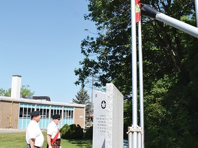 Photo by KEVIN McSHEFFREY/THE STANDARD
Royal Canadian Legion Branch 561 members Bruce Grant and Peter Unfried salute the Canadian flag on Canada Day at the cenotaph in Elliot Lake on the morning of July 1.