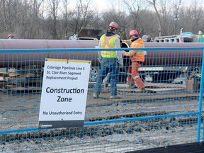 Crews are shown in this file photo connecting sections of pipe for an Enbridge pipeline replacement crossing beneath the St. Clair River. File photo/Postmedia Network