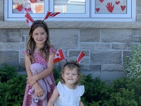 Kaia and Lani Brajuha had fun helping to decorate their house in time for Canada Day.