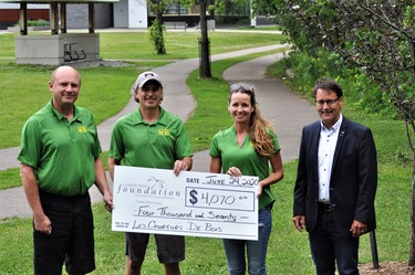 Les Coureurs de Bois recently received a grant of $4,070 from the PPDCF. In the photo from left, Rick Schroeder, Gary Serviss and Donna Saal of the running club and Matt Bradley, PPDCF board chairman. Submitted photo