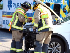 Firefighters respond to a collision at Queen Street East and Shannon Road on Wednesday, July 8, 2020 in Sault Ste. Marie, Ont. (BRIAN KELLY/THE SAULT STAR/POSTMEDIA NETWORK)
