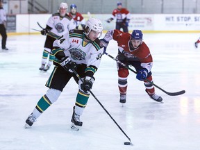 Michael Campbell (94) of the Elliot Lake Wildcats handles the puck while under pressure from Gio Biondi (74) of the Rayside-Balfour Canadians during NOJHL action in Elliot Lake, Ontario on Friday, February 7, 2020.