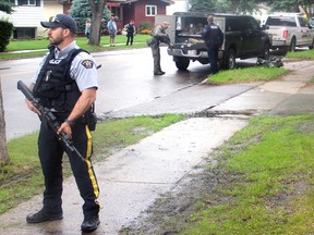 RCMP attend to the scene of a standoff in the Broxton Park subdivision in Spruce Grove Tuesday night.