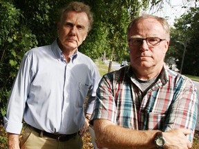 Peter Lynch, left, and Fraser Godfrey, pictured in 2018, were among about 80 neighbours opposed to a proposed residential development in a wooded area at 834 Lakeshore Rd. that city council rejected Nov. 5, 2018. A similar application is coming back to council for consideration Sept. 14. (Observer file photo)