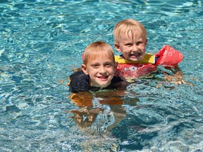 Brothers George, 6, and three-year-old Griffin Murdoch are able to enjoy a backyard pool this summer as public pools in Norfolk County remain closed. (ASHLEY TAYLOR)