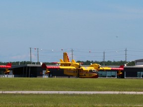 A pair of water bombers from Manitoba are parked with bird dog aircraft at the North Bay Fire Management facility at Jack Garland Airport, Thursday. The aircraft and crews are in the area to help fight forest fires across the province.
PJ Wilson/The Nugget