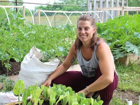 Caitlin Schneider is a member of the host garden program operated by Equal Ground Community Gardens. She has six beds at her Grand River Street home filled with produce that helps supply the city food bank.