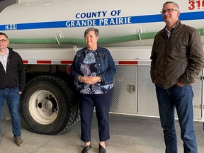 L-R: County of Grande Prairie Coun. Corey Beck, Reeve Leanne Beaupre and Grande Prairie-Wapiti MLA Travis Toews announce funding for two infrastructure projects at the La Glace Fire Hall on Thursday, July 9, 2020. A bridge culvert replacement grant for $1,278,000 and $750,000 for the La Glace Water Treatment Plant is expected to increase the capacity of the County of Grande Prairie to support economic growth within the region.