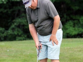 PETER RUICCI/Sault Star
Ryan Bastien lines up a putt on the 18th green on Sunday and, moments later, celebrates his victory in the Jane Barsanti Memorial at Root River Golf Club