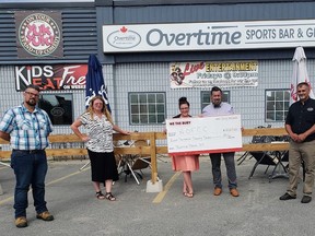 The We the Bury team, in partnership with Overtime Sports Bar and Grill and Jana Hospitality Consulting, raised $8027.20 in support of Northern Ontario Families of Children with Cancer with their third bottle drive held on July 4-5. Pictured from left to right are Riley Mignacca, We the Bury team member; Jana Schilkie, Jana Hospitality Consulting; Ashlie Wainman, We the Bury team member; Curtis Loiselle, We the Bury team member; Attilio Langella of Overtime Sports Bar and Grill; and Dayna Caruso of NOFCC.