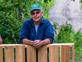 Roger Lewington, chair of the Huron Tract Land Trust Conservancy, stands with an osprey nest box. Handout