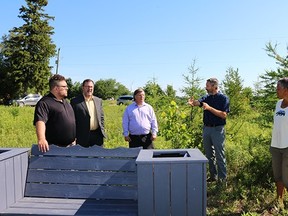 South Kent Coun. Anthony Ceccacci, left, mayor Darrin Canniff, Randall Van Wagner and Mark Peacock of the Lower Thames Valley Conservation Authority joined property owner Violet Shadd to tour 2.5-acres of her North Buxton-area property where she added a wetland and planted trees.