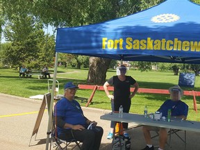 Fort Saskatchewan Rotary Club members Ted Griffiths and Stew Hennig manned the Rotary entrance of the Farmer’s Market alongside Chamber of Commerce Director, Tamara Dabels. The Rotary Club announced their 50/50 fundraiser on July 13. Photo Supplied.