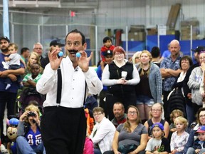 Magician Aytahn Ross performs a trick during the Grande Prairie International Street Performers Festival at Dave Barr Community Centre on Saturday July 21, 2018 in Grande Prairie, Alta.