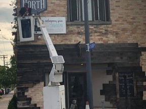 With the support of Locals and the help of J&D Signs, a sign directing shoppers to the Queen Street North District was hung on Thursday, July 9. Over 45 retailers, businesses and services are North of Durham Street.