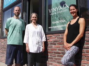 Rob Joanisse, left, Cristina Lella and Natalie DeMarco stand outside Vinyasa Yoga Studio on Algonquin Avenue. Along with yoga studios, gyms and other fitness centres will be allowed to reopen Friday as part of the next stage in the province’s reopening of the economy. Michael Lee/The Nugget