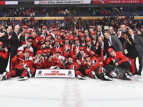 Benoit Roy, third from right, celebrates a gold-medal win with Team Canada at the 2018 IIHF World Junior Championship.