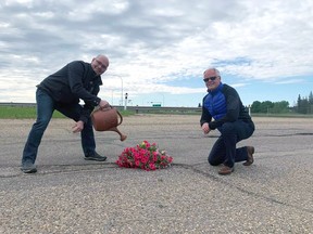 Spruce Grove-Stony Plain MLA Searle Turton and Spruce Grove Mayor Stuart Houston plant flowers in a pothole on the on ramp to Jennifer Heil Way from Hwy 779.
