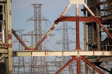 Power line towers can been seen through a section of the Lambton Generation Station near Courtright, where demolition has paused.