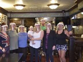 The staff of the Charles Dickens Pub in downtown Woodstock. The pub will be reopening Friday after four months closed because of the COVID-19 pandemic. Pictured, members of the pub’s staff with manager Karen Culley (second from right) and Culley’s grandson, Culley McGuire, who was in the pub briefly Thursday while Culley’s daughter helped put the finishing touches on the pub’s reopening. (Kathleen Saylors/Woodstock Sentinel-Review)